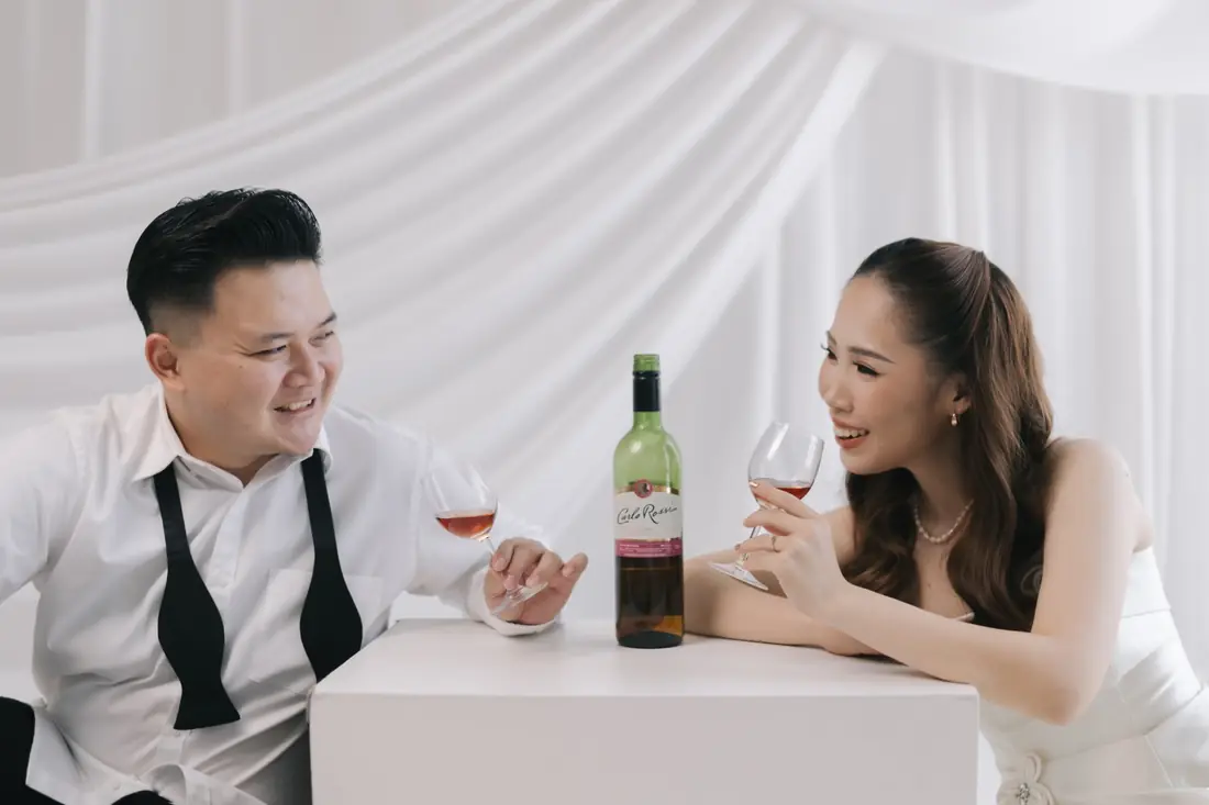 Irfan and Stephanie laughing over a glass of wine